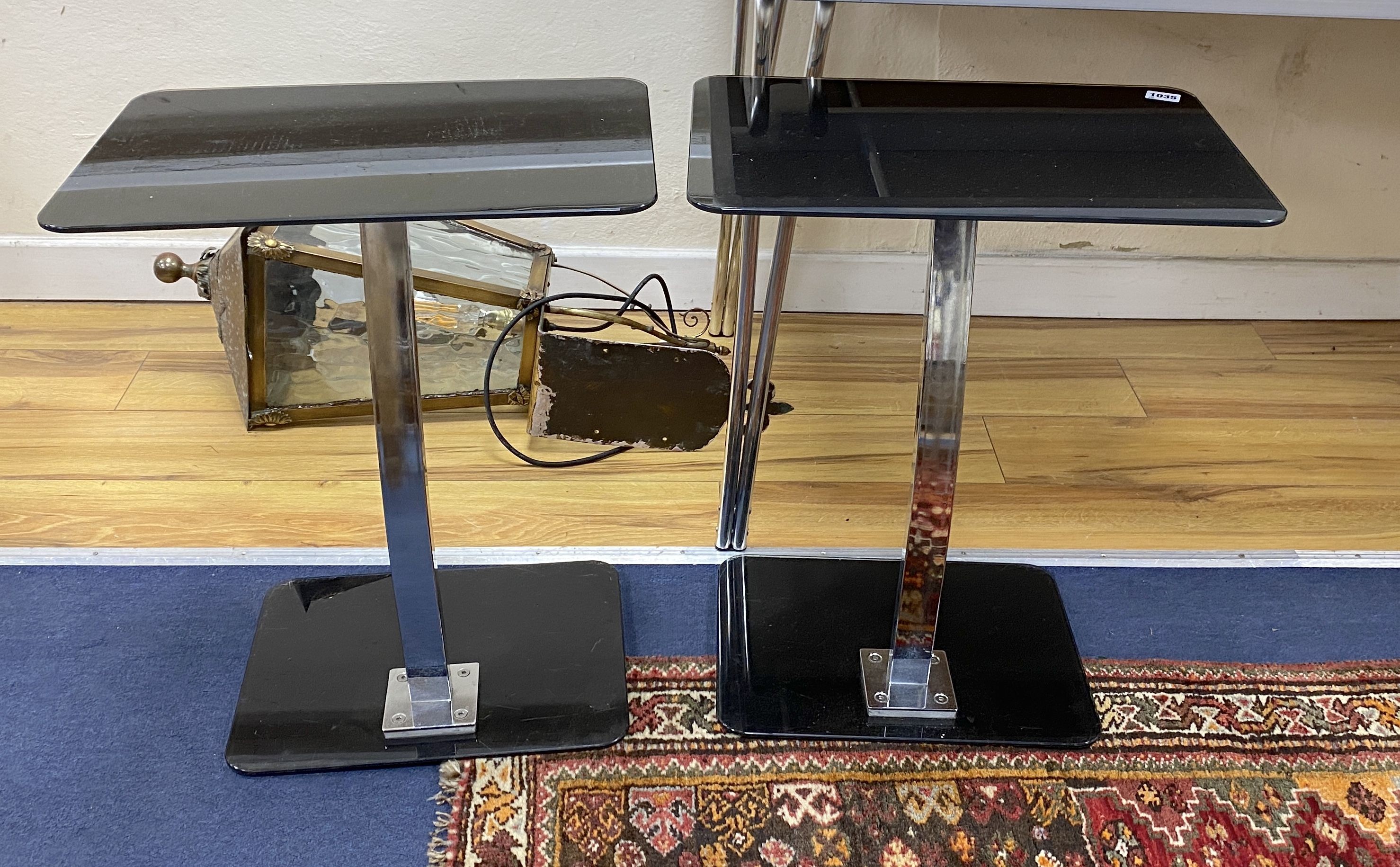 Pair of contemporary black glass and chrome side tables, width 40cm, depth 32cm, height 57cm